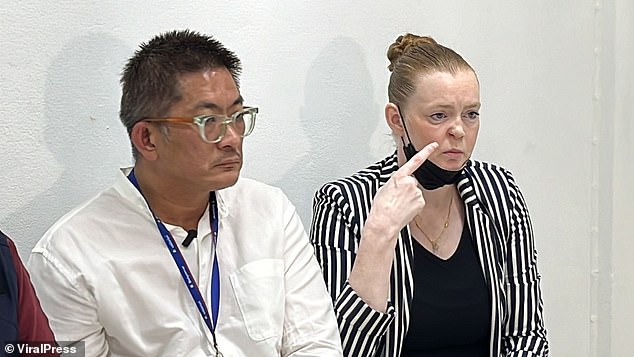 Mrs Cox and her husband Boonake Wongsuriyawattana attend a press conference in Bangkok.