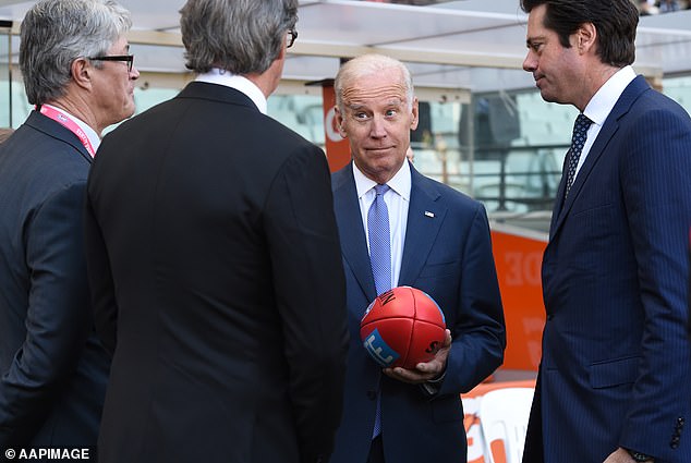 Biden is pictured attending an Australian Football League match in Melbourne in July 2016, where he appeared confused as then-competition boss Gillon McLachlan (right) attempted to explain the rules to him.