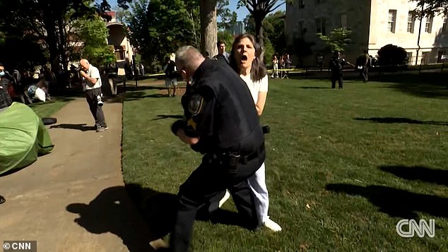 The teacher refused a police order to get on the ground before the officer forced her down.