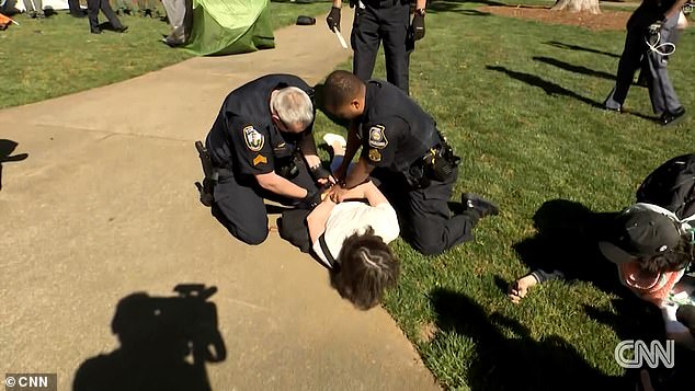 Economics professor Caroline Fohlin was knocked to the concrete by a police officer after she tried to intervene during the arrest of another protester.