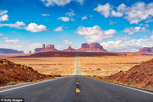 Long road leading towards Monument Valley seen from Forrest Gump Point, Utah.  Monument Valley at $1,529 per person is one of the least expensive in the study.