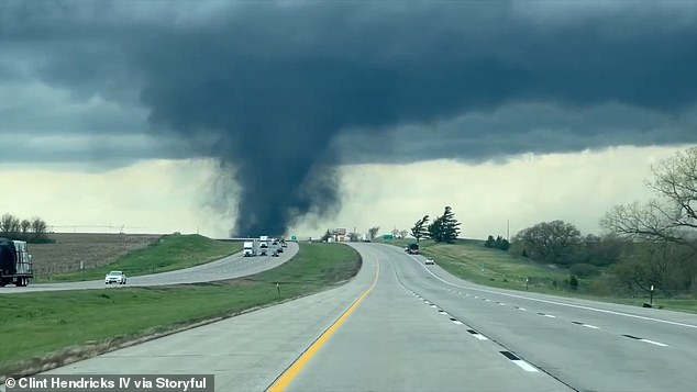 The storm could be seen crossing a six-lane highway as the tornado made its way.