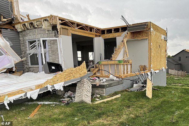 Dozens of houses, crushed and destroyed by the passage of the tornado