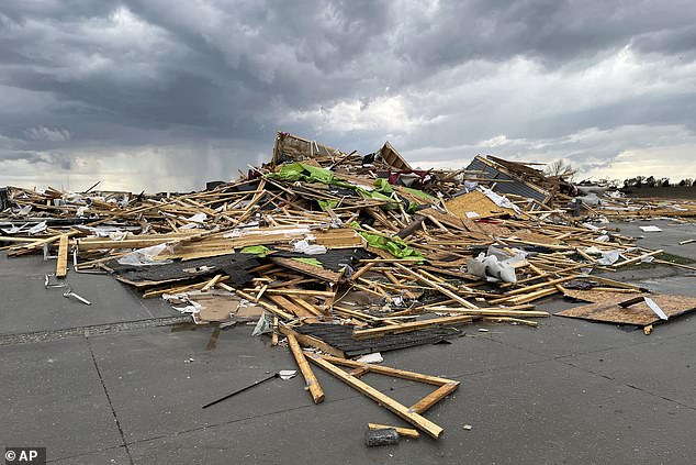 Debris is seen from a destroyed home northwest of Omaha, Nebraska, after a tornado ripped through the area.