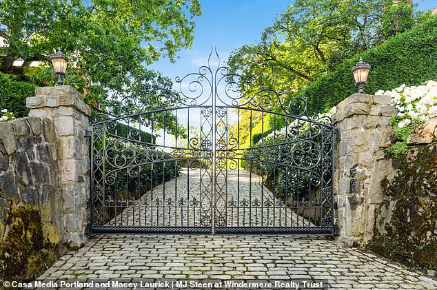 Beyond the gated entrance, a cobblestone path creates a wide entrance.