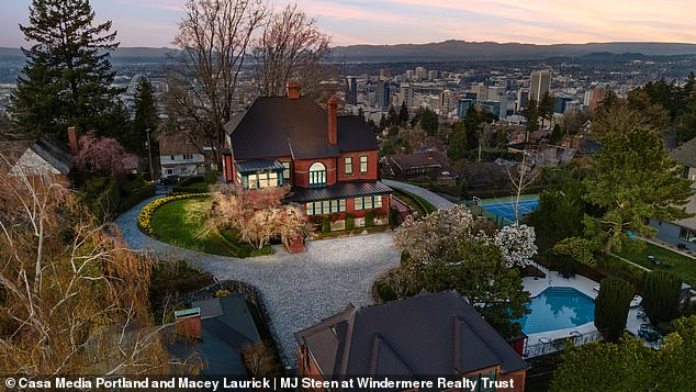 The house takes pride of place with the city of Portland seen below.