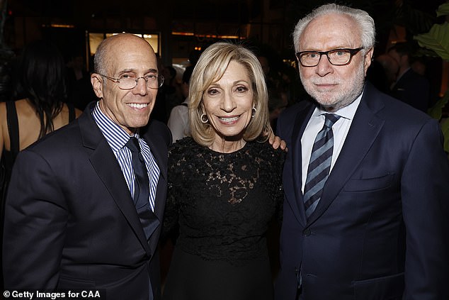 Andrea, dressed in an elegant black floral dress, also rubbed shoulders with former CNN name Wolf Blitzer (right) and movie mogul Jeffrey Katzenberg (left).