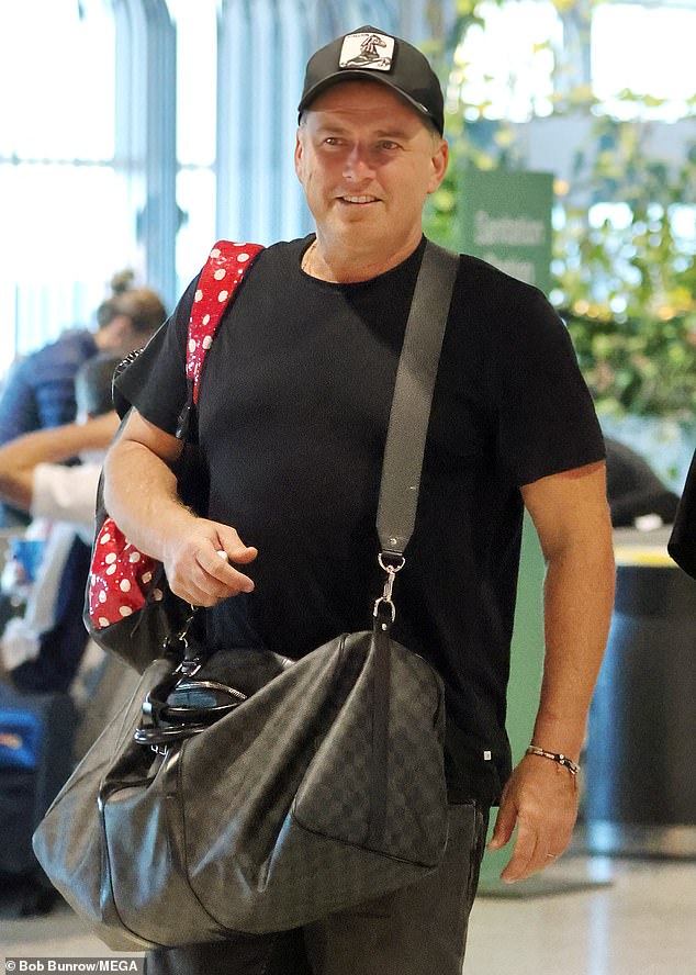 Karl seemed to be in good spirits as he strolled through the airport ready for his vacation.