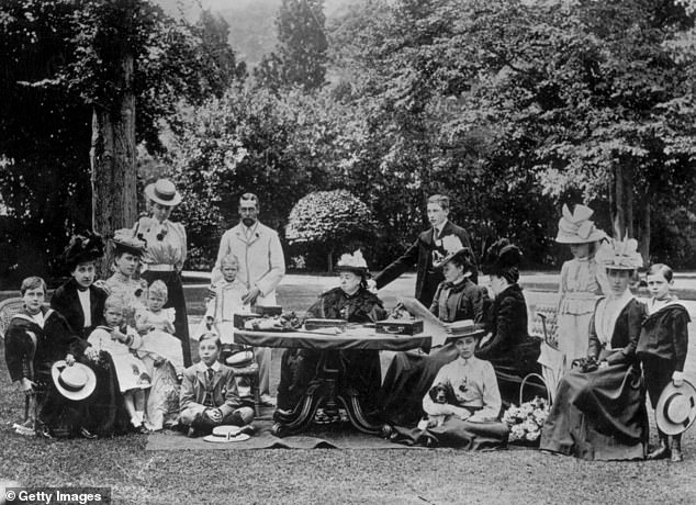 Queen Victoria surrounded by members of the royal family at Osborne House on the Isle of Wight, including Princess Ena, third from the right.