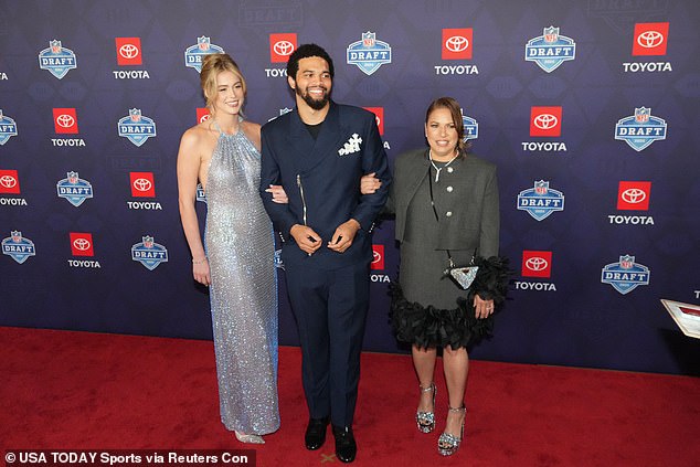 The NFL's sexiest new couple posed on the red carpet with Williams' mother, Dayna Price (right)