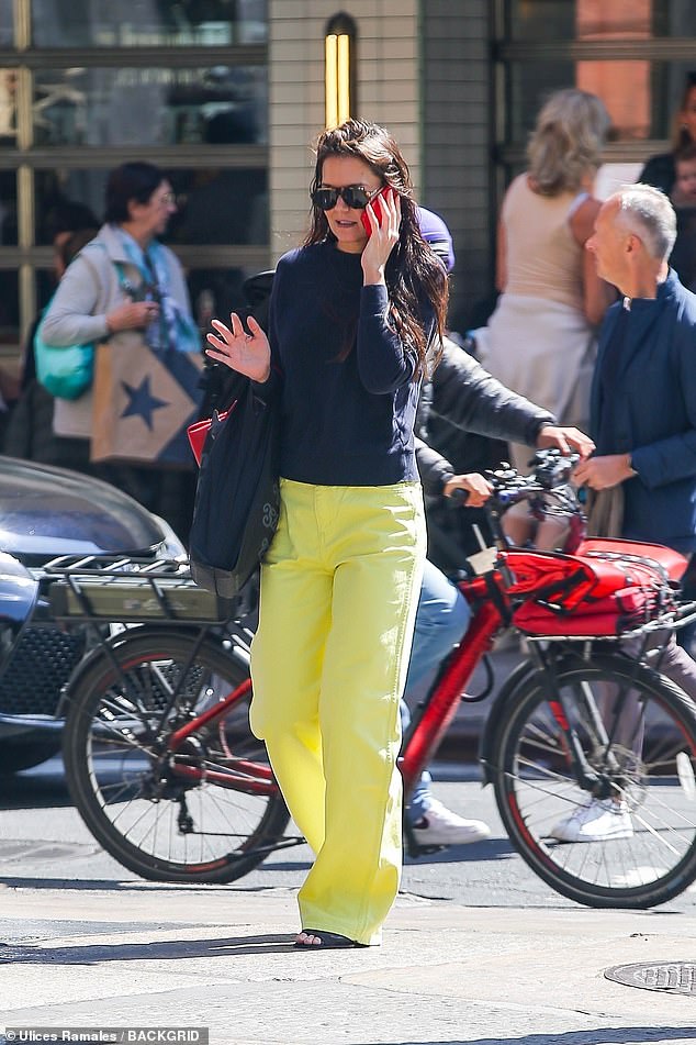 The Dawson's Creek star, 45, wore striking yellow pants and a navy top, paired with black sandals.