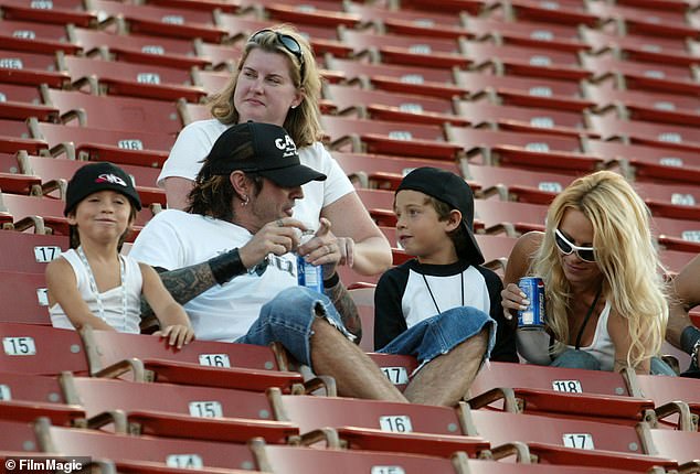 Pamela and Tommy with their children at the AL Coliseum in Los Angeles in 2003