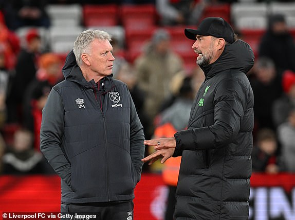 LIVERPOOL, ENGLAND - DECEMBER 20: (SUN SUNDAY) Jurgen Klopp manager of Liverpool with David Moyes manager of West Ham during the warm up before the Carabao Cup quarter final match between Liverpool and West Ham United at Anfield on December 20, 2023 in Liverpool, England.  (Photo by John Powell/Liverpool FC via Getty Images)
