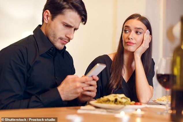 A big faux pas that's easy to make is to constantly pick up the phone while you're on a first date;  you may not even realize you're doing it (stock image)