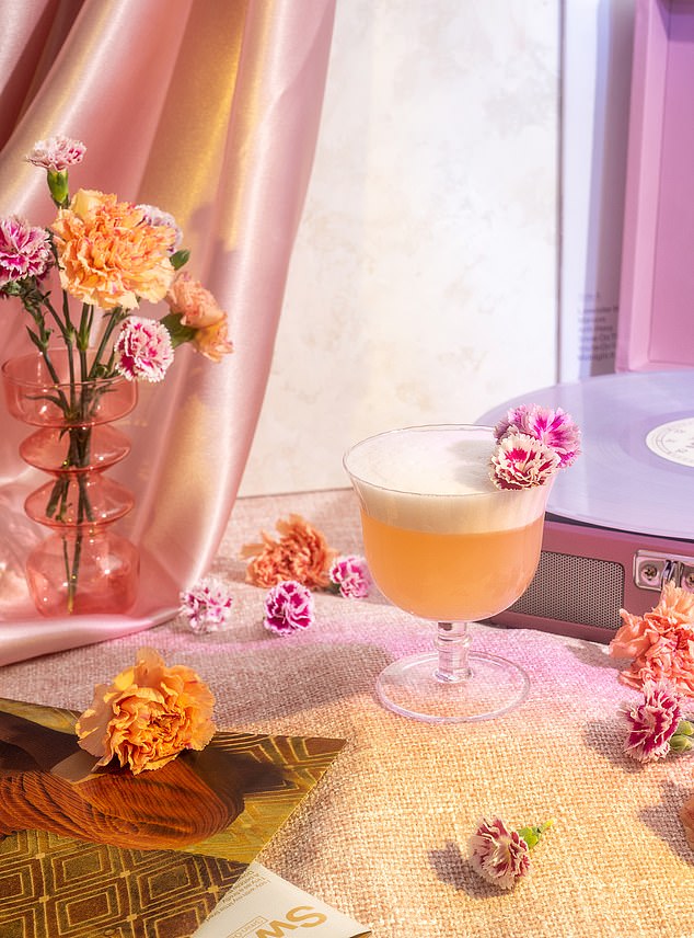 Pictured: A Grapefruit Gin Fizz cocktail inspired by Taylor Swift's song 'Sweet Nothing' from her album Midnights.