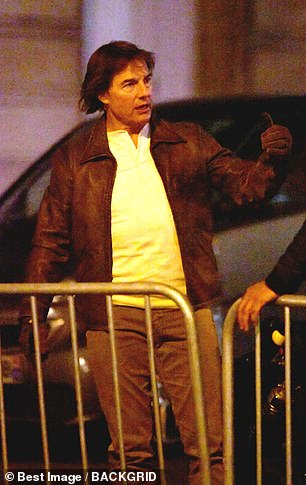 The Hollywood legend, 61, wore a brown leather jacket with matching gloves and beige pants.