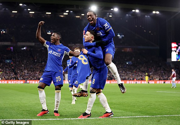 BIRMINGHAM, ENGLAND - FEBRUARY 7: Enzo Fernandez of Chelsea celebrates with Moisés Caicedo and Axel Disasi of Chelsea after scoring his team's third goal with a direct free kick during the FA Cup fourth round replay match of the Emirates between Aston Villa and Chelsea at Villa Park on February 07, 2024 in Birmingham, England.  (Photo by Catherine Ivill/Getty Images)