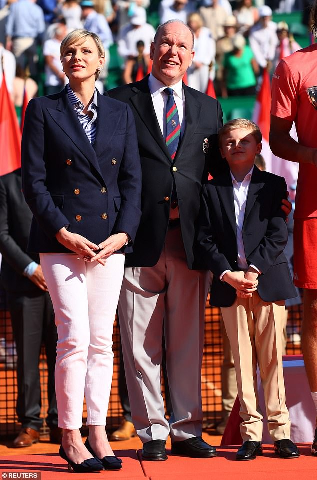 Princess Charlene of Monaco and Prince Albert are pictured with their son Jacques during the trophy presentation on April 14.