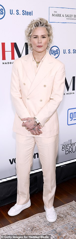 Ashlyn, for her part, looked pretty in a pale pink double-breasted suit with gold buttons on the jacket.