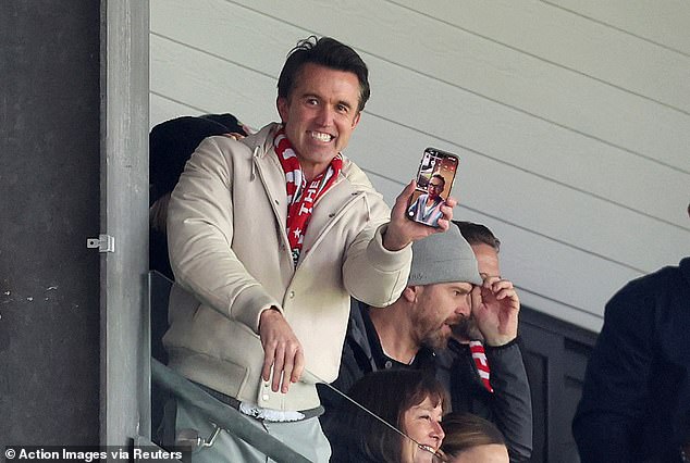 He was also photographed on FaceTime with Reynolds, with the pair smiling as Andy Cannon gave his team the lead in the 88th minute (above).