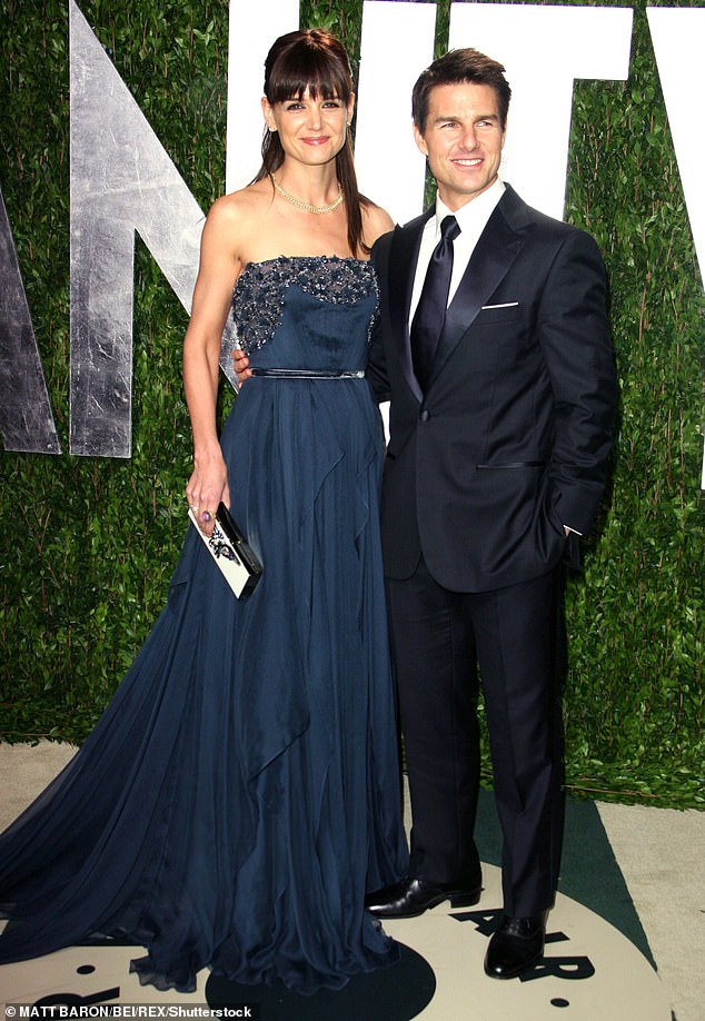 Katie Holmes filed for divorce from Tom Cruise in June 2012 after five and a half years of marriage;  The former couple is seen in February 2012, approximately a year before their separation.