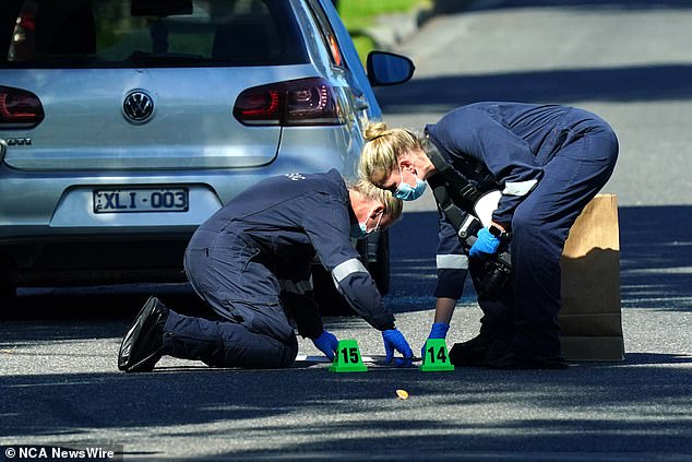 Mr Toth was pronounced dead at the scene and Victoria Police are investigating whether his execution was targeted (pictured, officers at the scene)