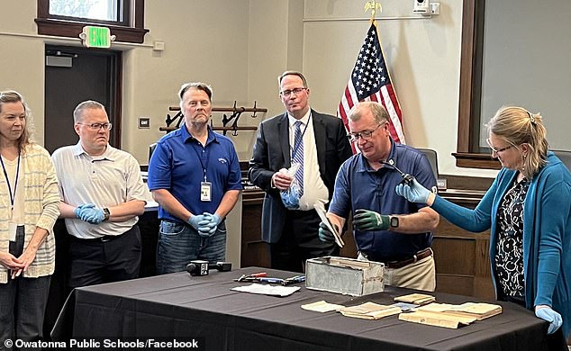 Olson sported a pair of latex gloves at Monday's news conference, where he pulled out the items and described each one to the crowd.