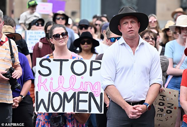 Queensland Premier Steve Miles (right) joined thousands of people in King George Square at 11am and marched through Brisbane city centre.
