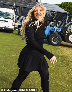 Posting on Instagram, the Dance Monkey star shared photos of herself at the event looking almost unrecognizable in a black turtleneck top, matching mini skirt and back stockings.
