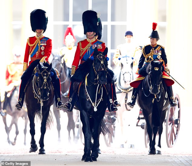 King Charles III, dressed in his Welsh Guards uniform, flanked by Prince William and Princess Anne, leaves Buckingham Palace on horseback to attend Trooping the Color on June 17, 2023.