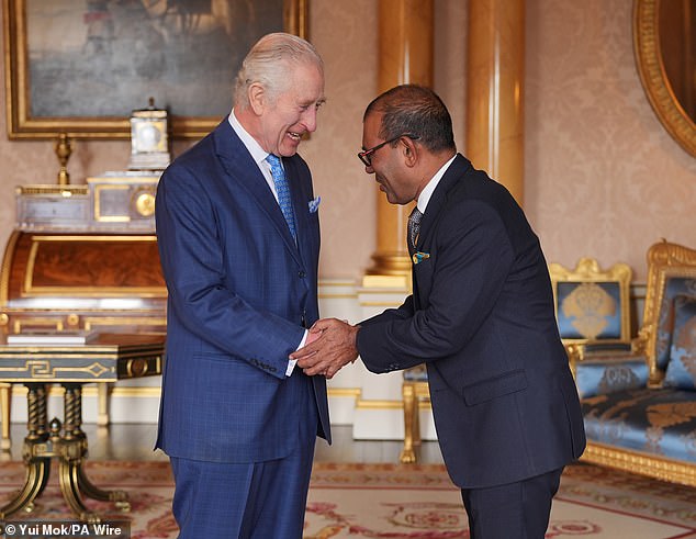 King Charles, 75, smiled as he met Mohamed Nasheed, 56, secretary general of the Climate Vulnerability Forum, at Buckingham Palace on March 27.