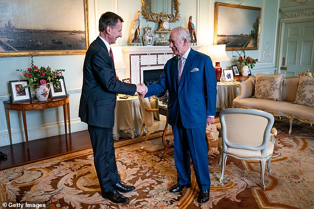 Charles has continued to work behind the scenes, seen here meeting Chancellor of the Exchequer Jeremy Hunt in the private audience room at Buckingham Palace on March 5.