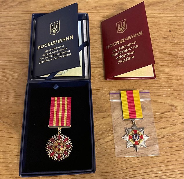 Three days after the invasion, and having never carried a weapon before, he enrolled in the Territorial Defense Forces of Ukraine (pictured: Kariakin medals).