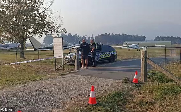 Witnesses reported seeing the plane apparently struggling to land before crashing into a meadow, just in front of the runway (pictured, police at the scene).