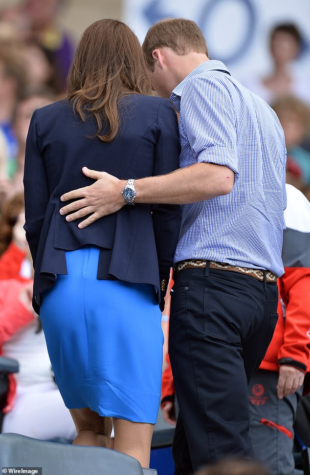 The Prince put his hand on his wife's back during the Commonwealth Games in 2014.