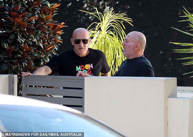 Friends are seen at Paul Kent's home in Lilyfield on Sunday after he was suspended by Fox Sport.