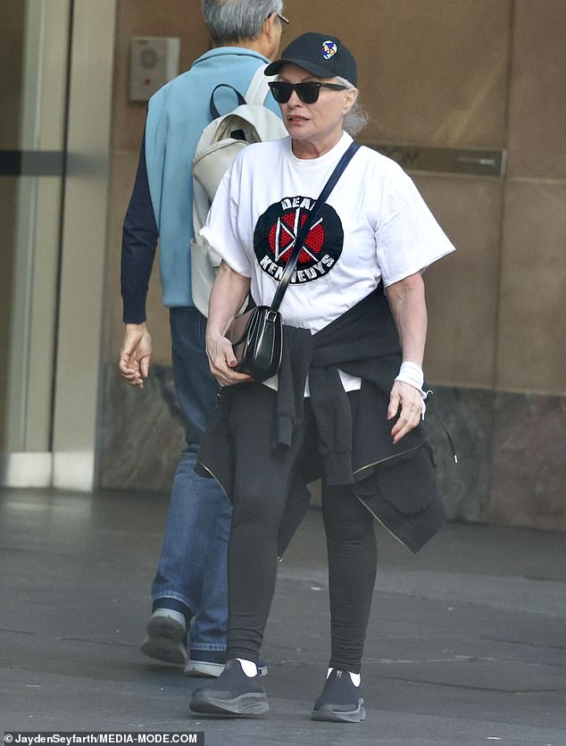 The singer completed her look with a black baseball cap, a Chanel crossbody bag, and statement sunglasses.