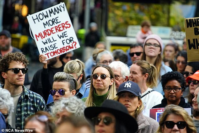 Thousands of protesters marched and rallied (pictured) across Australia over the weekend to demand an end to violence against women.