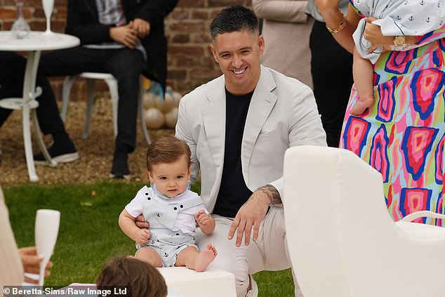 Billy dressed in a crisp cream suit for the day and was all smiles as he enjoyed time with his son on the big day.