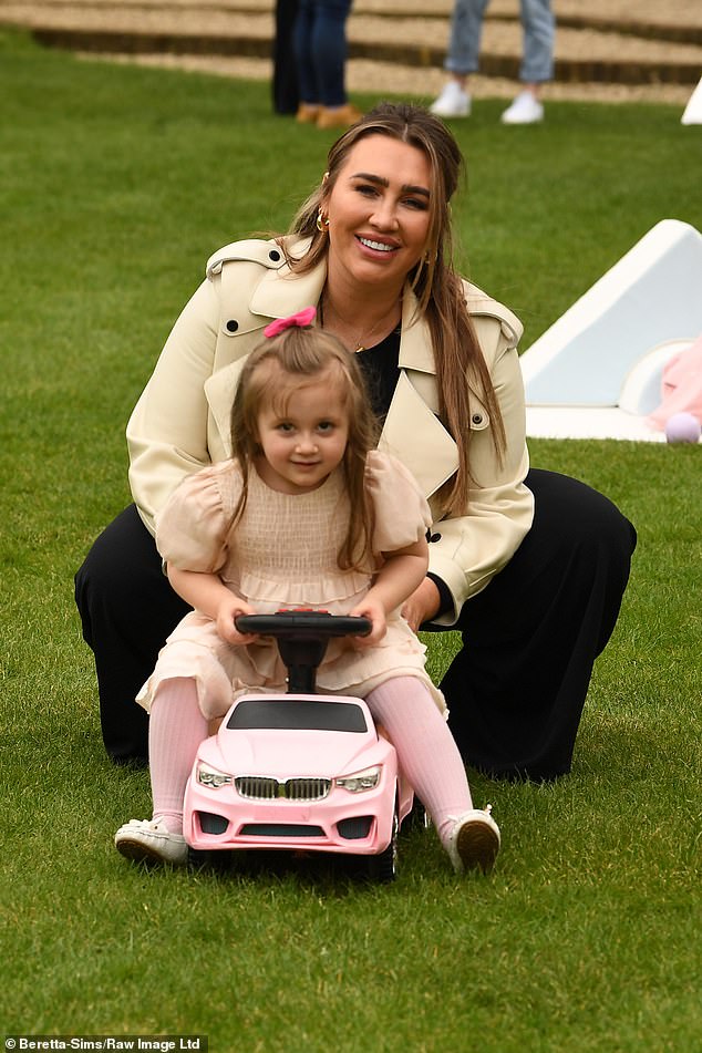Lauren Goodger was all smiles as she and her two-year-old Larose played with a pink car together.