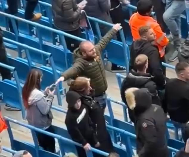 A Manchester City fan was caught on social media in March allegedly making an airplane gesture.