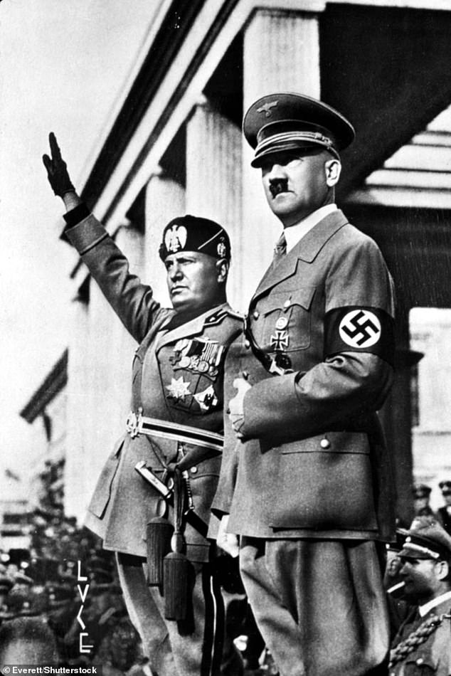 Benito Mussolini (left) and Adolf Hitler (right) in Berlin, undated.  Mussolini raises his arm in a Nazi salute