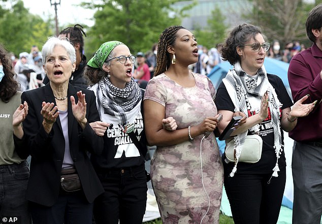 Stein (left) links arms with Councilwoman Alisha Sonnier (second from right) and Councilwoman President Megan Green (right) while participating in a pro-Palestinian protest at WashU in St. Louis, Missouri, on Saturday.