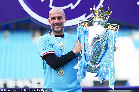 MANCHESTER, ENGLAND - MAY 21: Pep Guardiola, manager of Manchester City, poses for a photograph with the Premier League Trophy after the Premier League match between Manchester City and Chelsea FC at the Etihad Stadium on May 21 May 2023 in Manchester, England.  (Photo by Lexy Ilsley - Manchester City/Manchester City FC via Getty Images)
