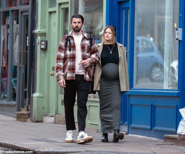 The TV presenter, 34, who revealed in March that she was six months pregnant, was seen walking hand in hand with her scientist partner.