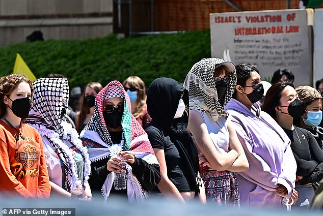 Maher joked that the Palestinian keffiyeh scarf, seen here on UCLA students, is today's equivalent of Che Guevara's T-shirt.