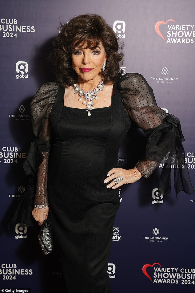 Dame Joan wore a pair of black heels to add a few inches to her height and carried a dazzling handbag adorned with sparkling silver sequins.