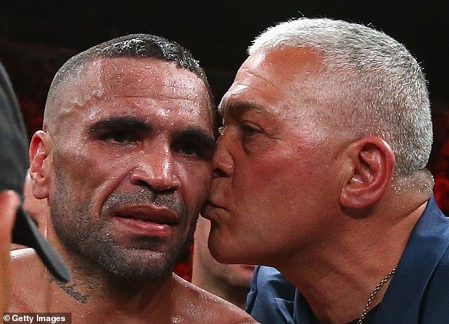 Anthony Mundine celebrates with Mick Gatto after a victory in 2014. Gatto had been a heavyweight boxer.