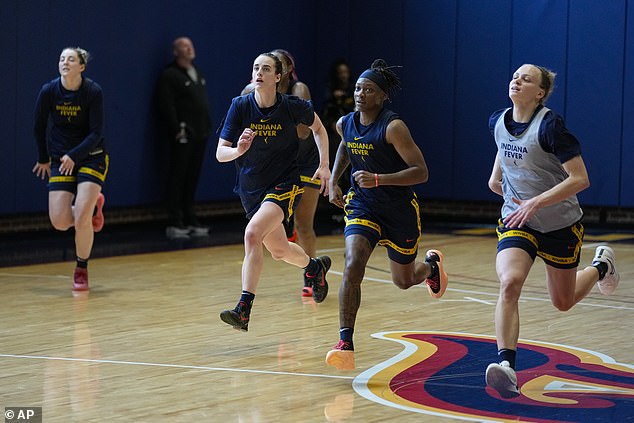 Clark (center left) in practice with teammates, including Erica Wheeler (center) in Indianapolis