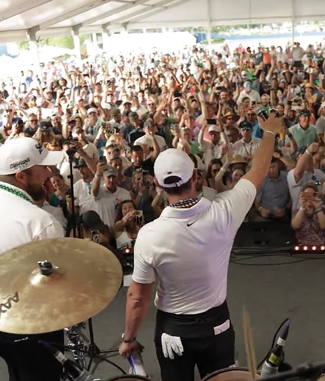Hundreds of fans watched McIlroy perform Journey's famous 1981 hit alongside a live band.